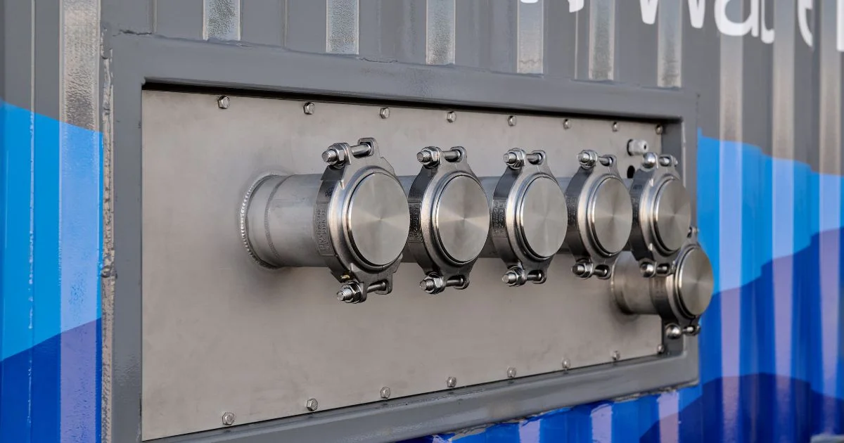 Close-up of mobile water system connection ports.